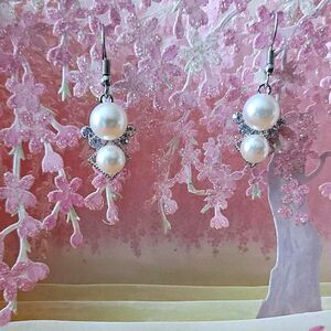 Silver and white faux pearl earrings with a touch of vintage glamour